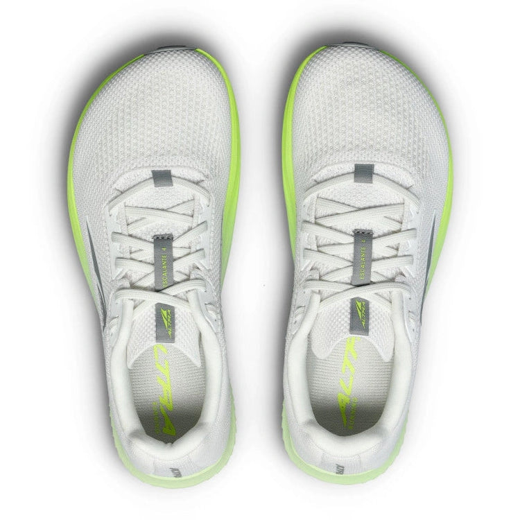 A pair of white altra running shoes with bright neon green accents on the midsole and tongue, shown from a top-down view on a white background.